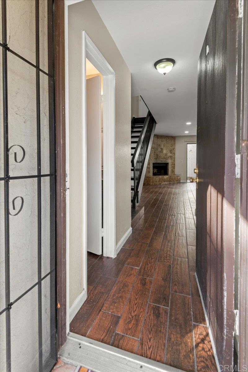 389 Shady Lane, Unit D El Cajon, CA 92021 - Photo 7 of 30 a view of a hallway with wooden floor
