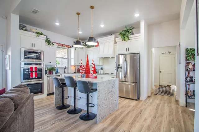 a bathroom with a granite countertop sink mirror and double