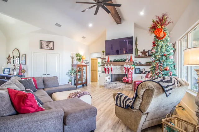 a bed room with a bed and a potted plant