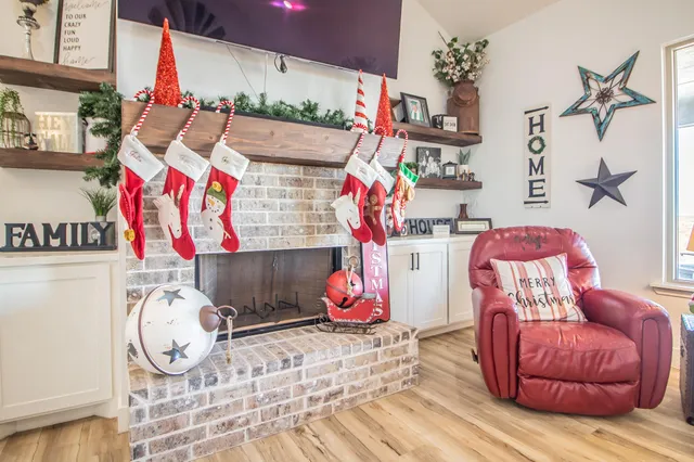 a spacious en suite bathroom with a granite countertop tub sink and mirror