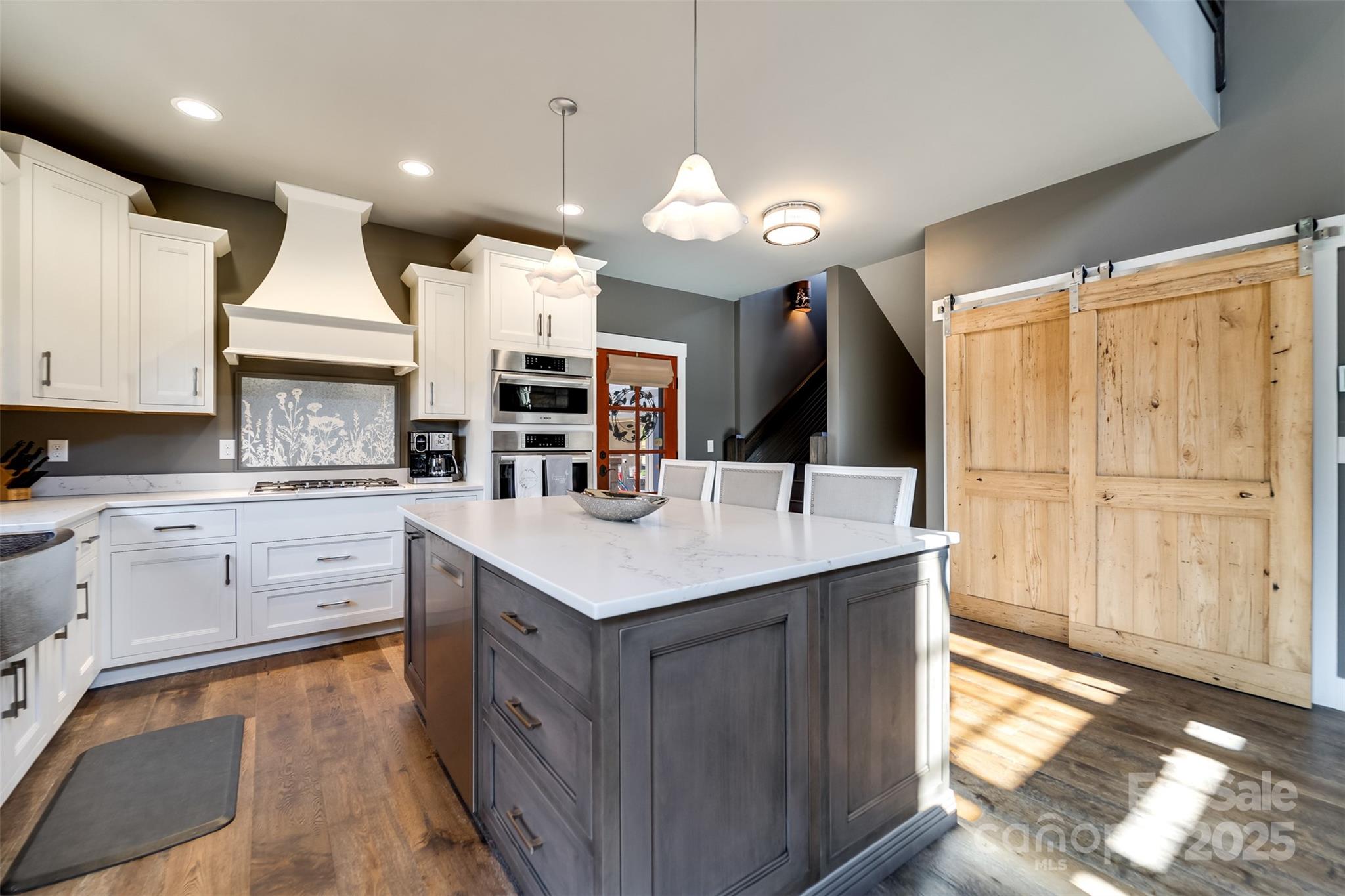 117 Amberleaf Way Cullowhee, NC 28723 - Photo 11 of 47 a kitchen with cabinets and window