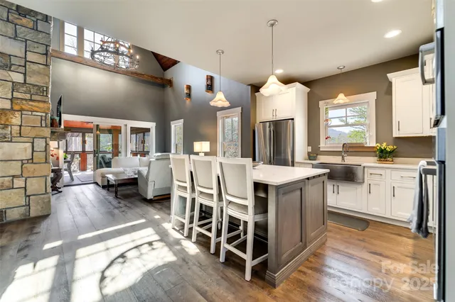 a living room with furniture tv and a large window
