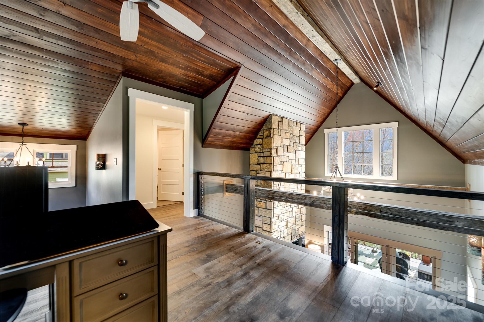 117 Amberleaf Way Cullowhee, NC 28723 - Photo 26 of 47 a view of a hallway with wooden floor and staircase