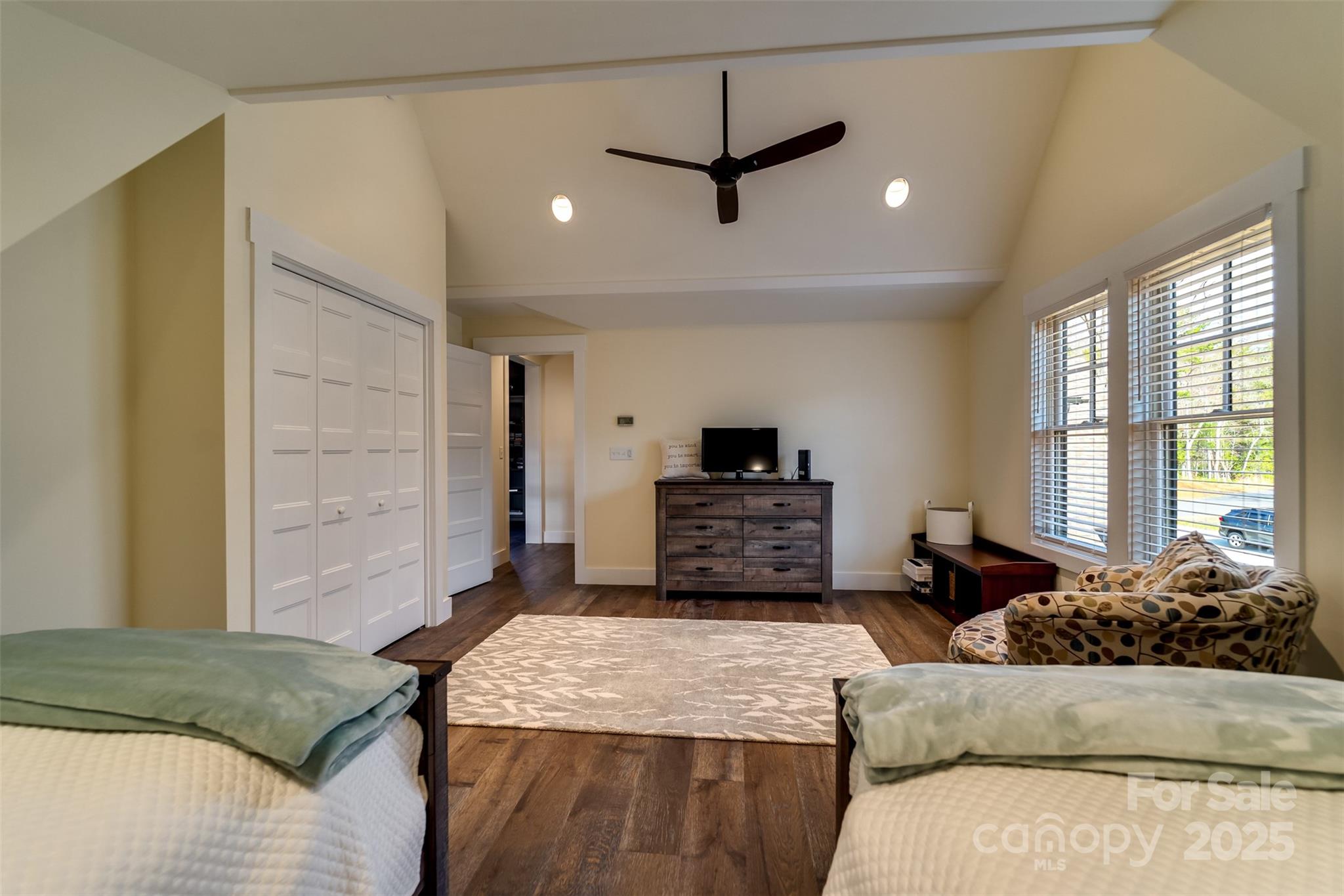 117 Amberleaf Way Cullowhee, NC 28723 - Photo 28 of 47 a living room with a bed furniture and a flat screen tv
