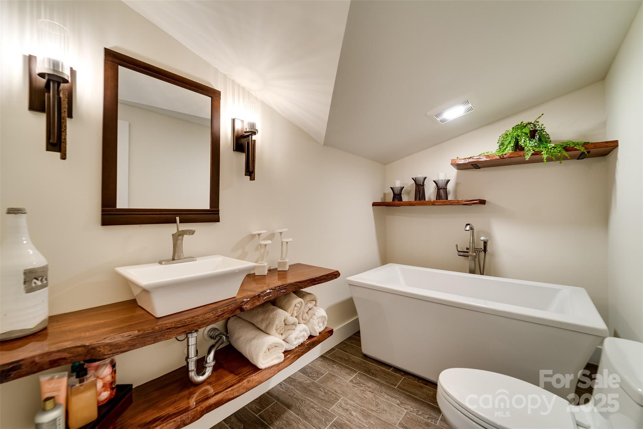 117 Amberleaf Way Cullowhee, NC 28723 - Photo 29 of 47 a bathroom with a sink toilet and mirror