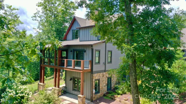 front view of a house with a tree