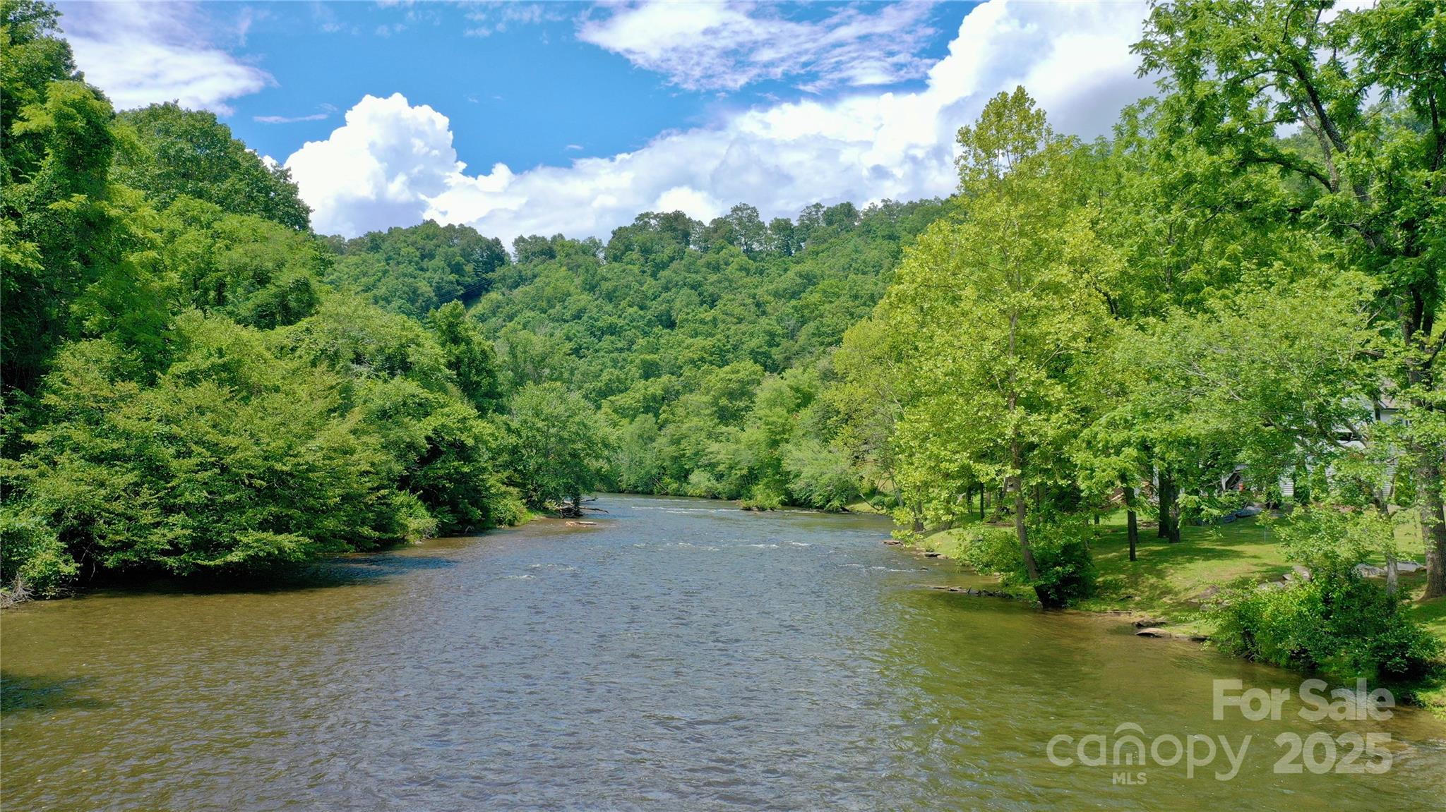 117 Amberleaf Way Cullowhee, NC 28723 - Photo 43 of 47 a view of a lake with a yard