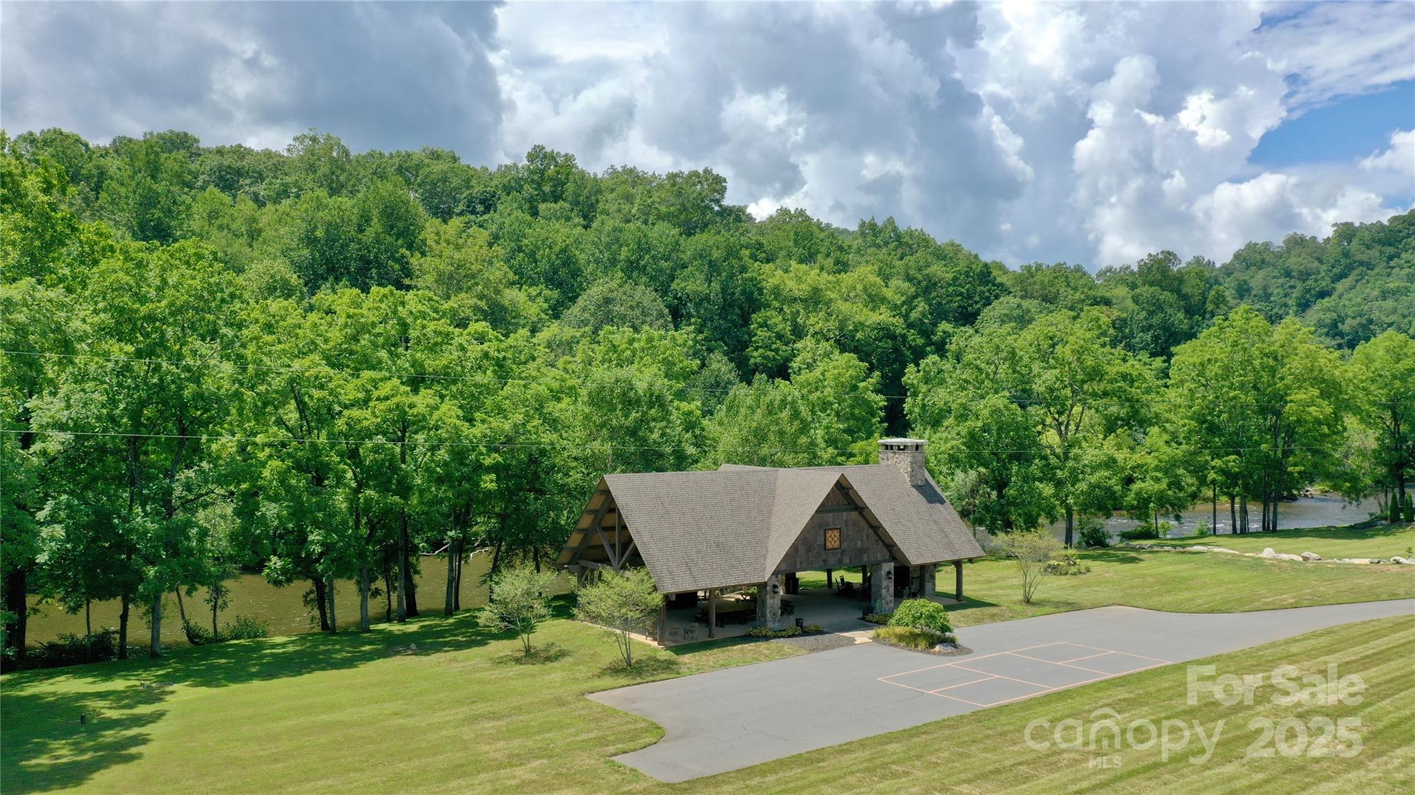 117 Amberleaf Way Cullowhee, NC 28723 - Photo 44 of 47 a view of backyard with table and chairs and wooden fence