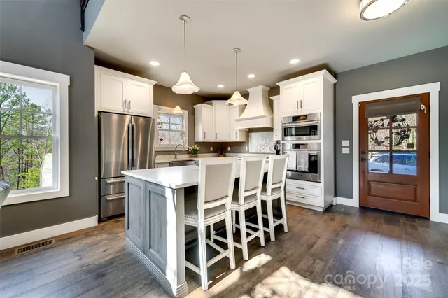 a kitchen with counter space cabinets and appliances