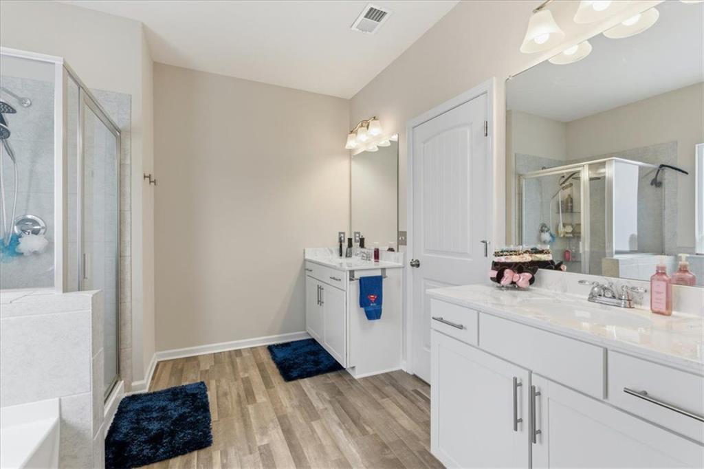 140 Bryon Lane Acworth, GA 30102 - Photo 20 of 39 a bathroom with a sink a toilet a mirror and shower