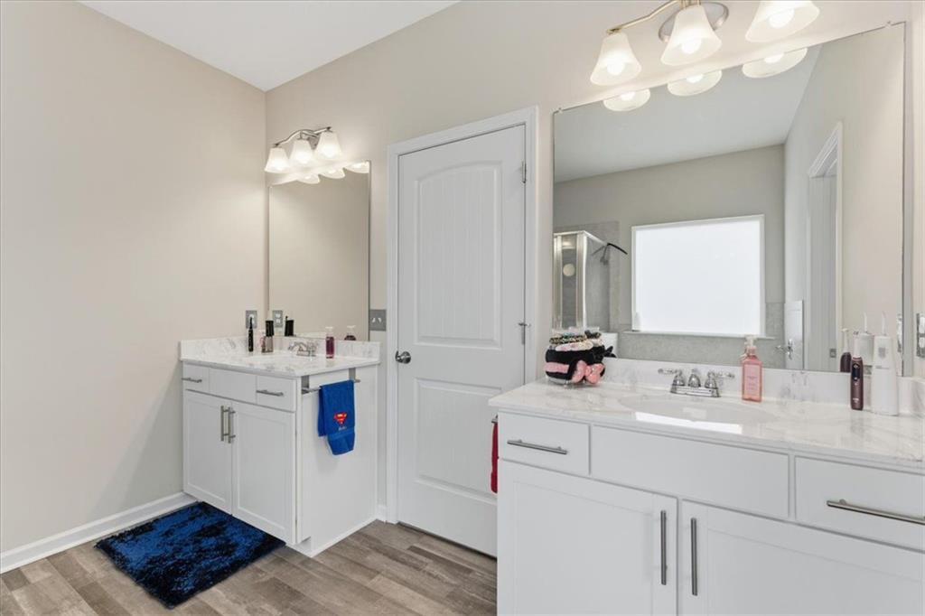 140 Bryon Lane Acworth, GA 30102 - Photo 21 of 39 a bathroom with a sink vanity and a mirror