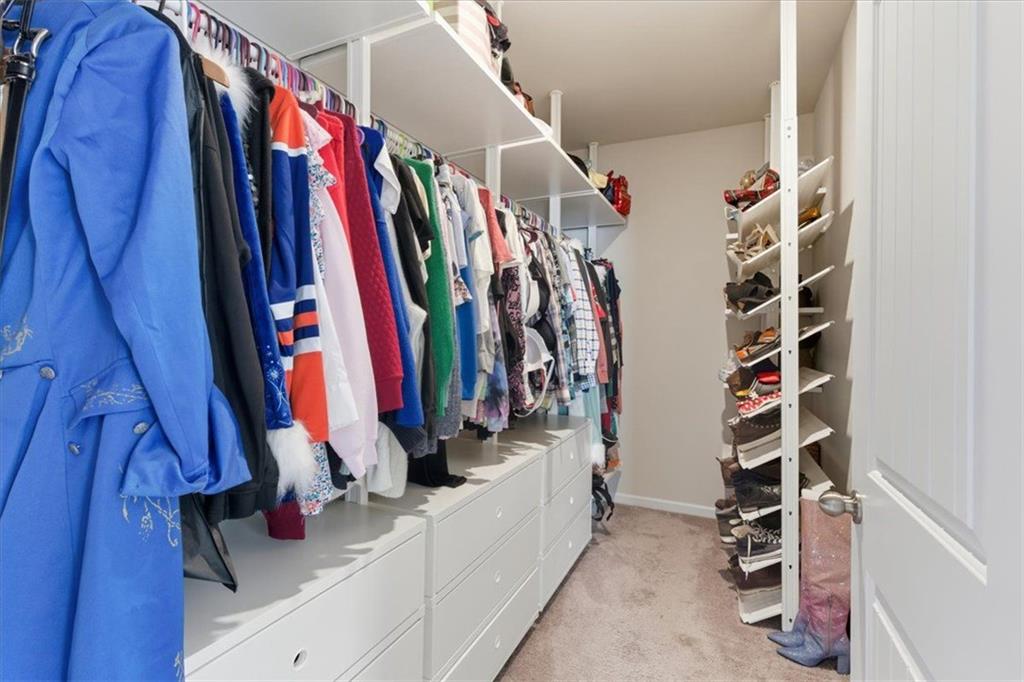 140 Bryon Lane Acworth, GA 30102 - Photo 29 of 39 a view of walk in closet with clothes