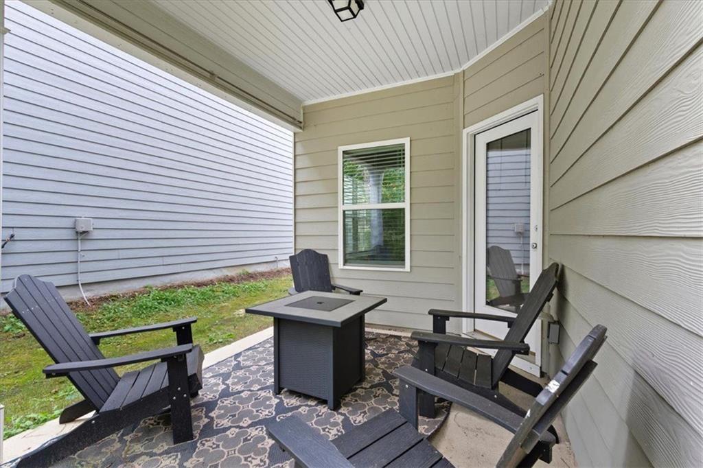 140 Bryon Lane Acworth, GA 30102 - Photo 32 of 39 a view of a patio with table and chairs and potted plants
