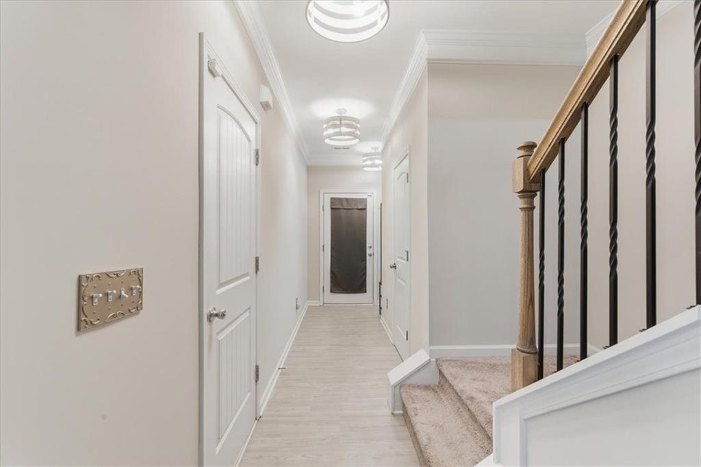 140 Bryon Lane Acworth, GA 30102 - Photo 4 of 39 a view of a hallway with wooden floor and staircase