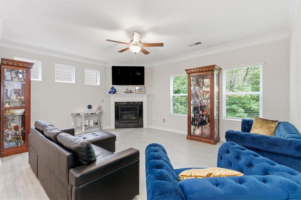 140 Bryon Lane Acworth, GA 30102 - Photo 5 of 39 a living room with furniture flat screen tv and a fireplace