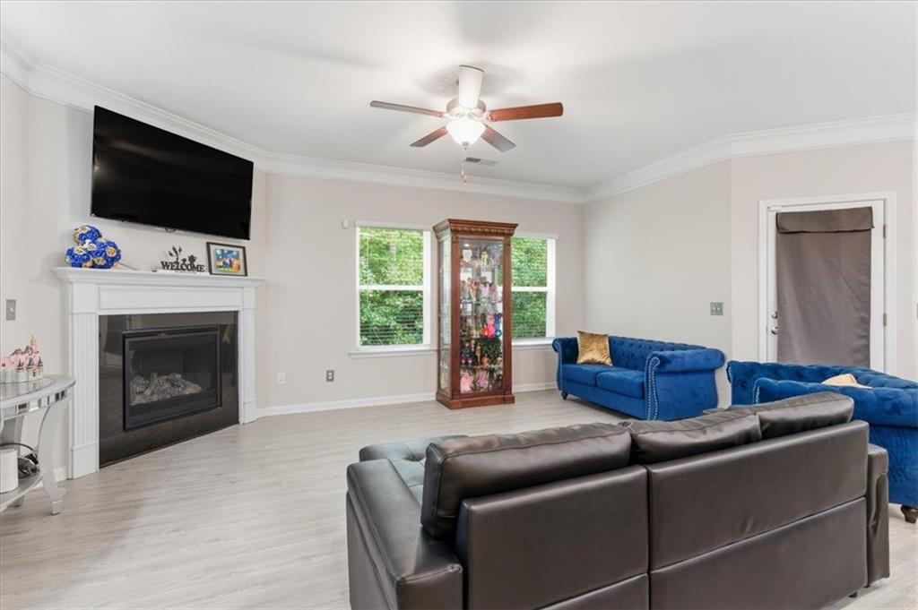 140 Bryon Lane Acworth, GA 30102 - Photo 6 of 39 a living room with furniture a flat screen tv and a fireplace