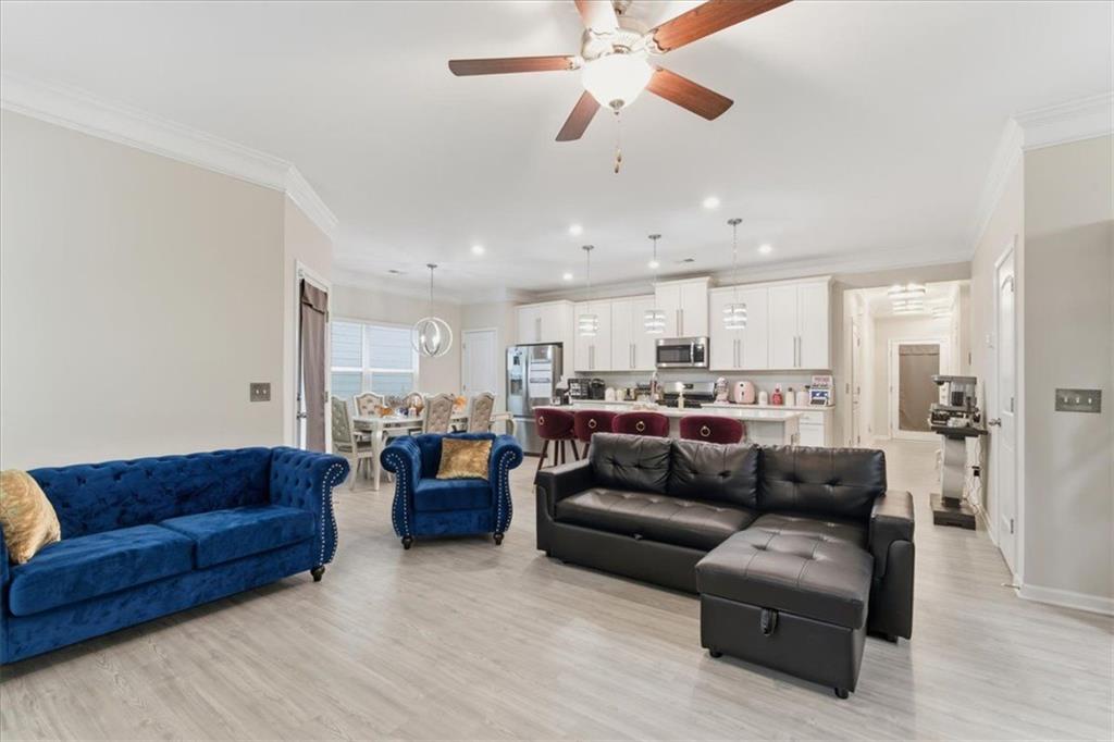 140 Bryon Lane Acworth, GA 30102 - Photo 7 of 39 a living room with furniture and a ceiling fan