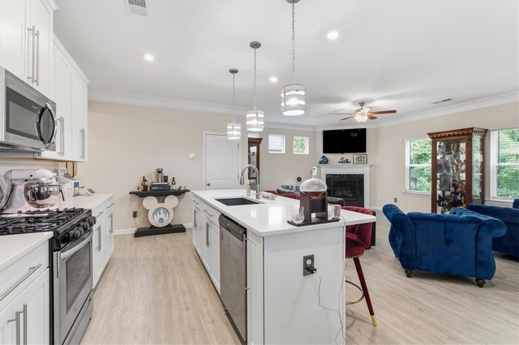 140 Bryon Lane Acworth, GA 30102 - Photo 10 of 39 a kitchen with a sink stove and wooden floor
