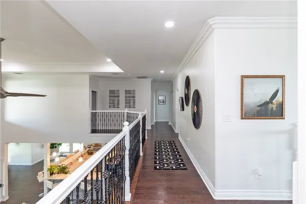 a view of a hallway with stairs