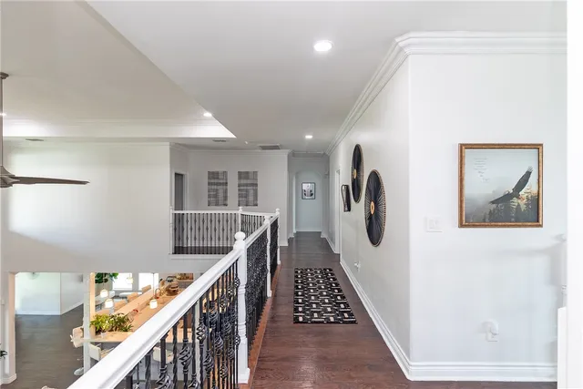 a view of a hallway with stairs