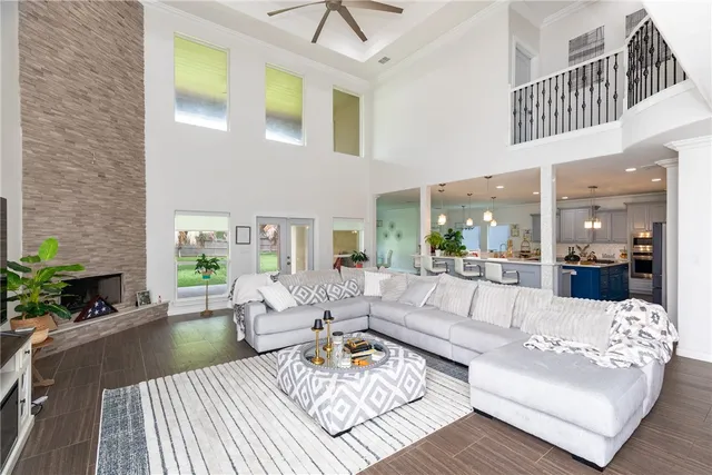 a living room with patio furniture and a fireplace