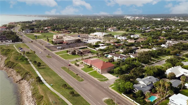 an aerial view of residential houses with outdoor space