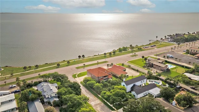 an aerial view of a city and ocean view