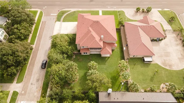 an aerial view of a house with swimming pool
