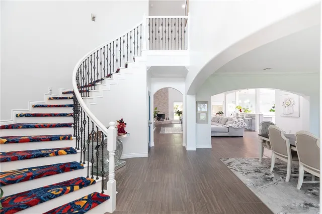 a view of entryway livingroom and hall with wooden floor