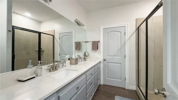 a bathroom with a double vanity sink mirror and double