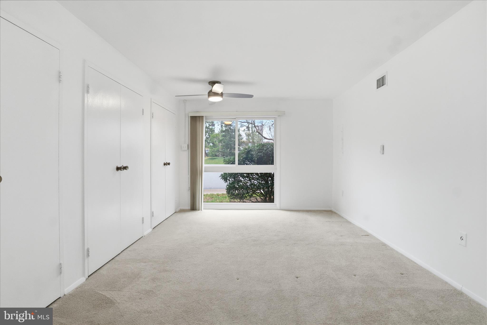 250 South Reynolds Street, Unit 105 Alexandria, VA 22304 - Photo 20 of 39 a view of an empty room with a window