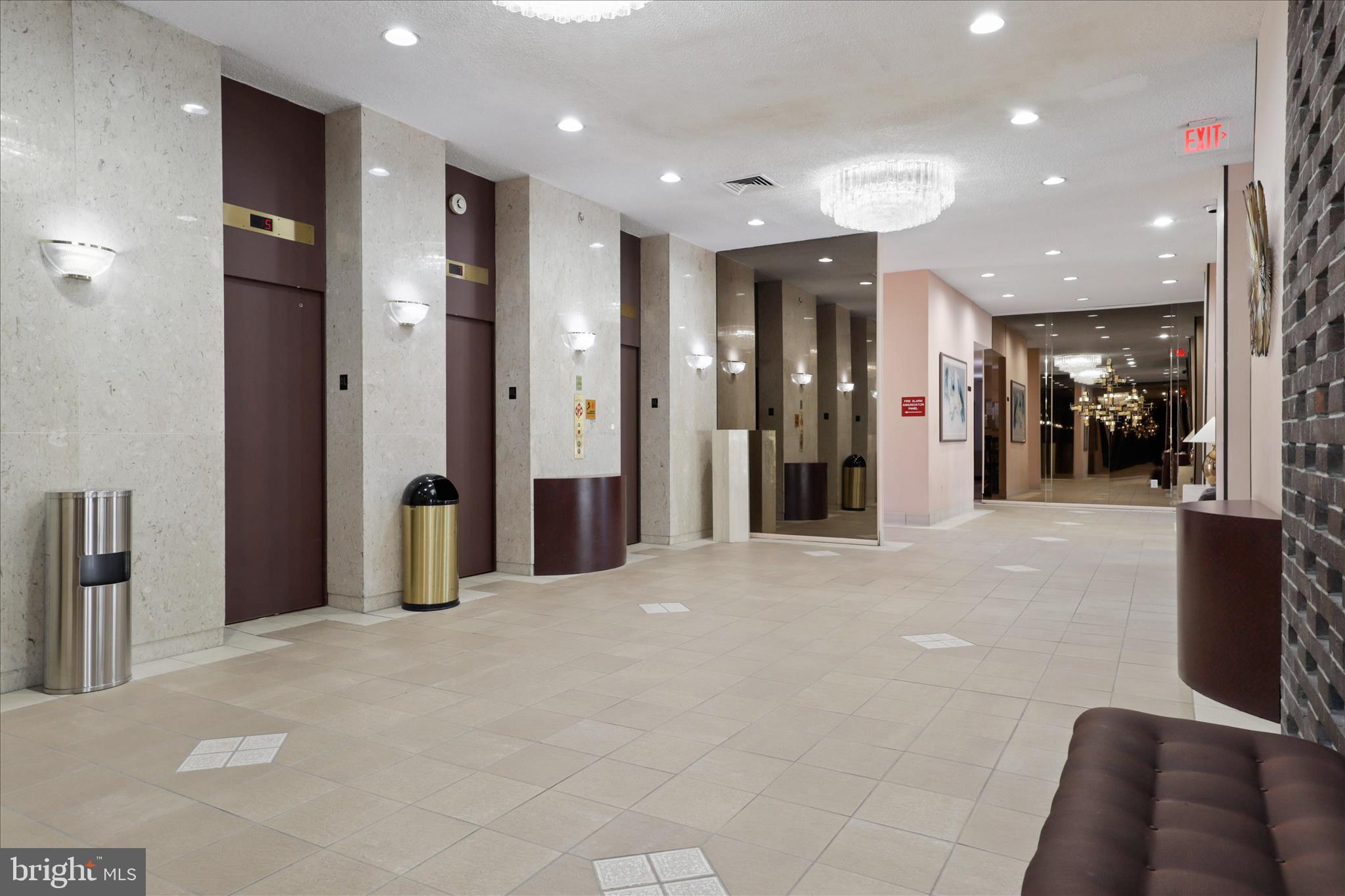 250 South Reynolds Street, Unit 105 Alexandria, VA 22304 - Photo 26 of 39 a view of a hallway with furniture and a refrigerator