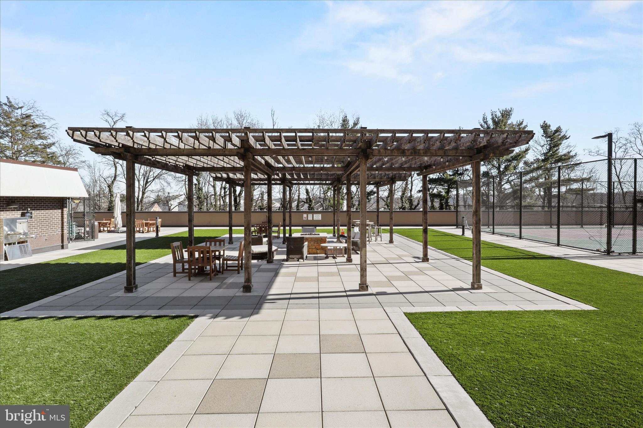 250 South Reynolds Street, Unit 105 Alexandria, VA 22304 - Photo 28 of 39 a view of a patio with a backyard