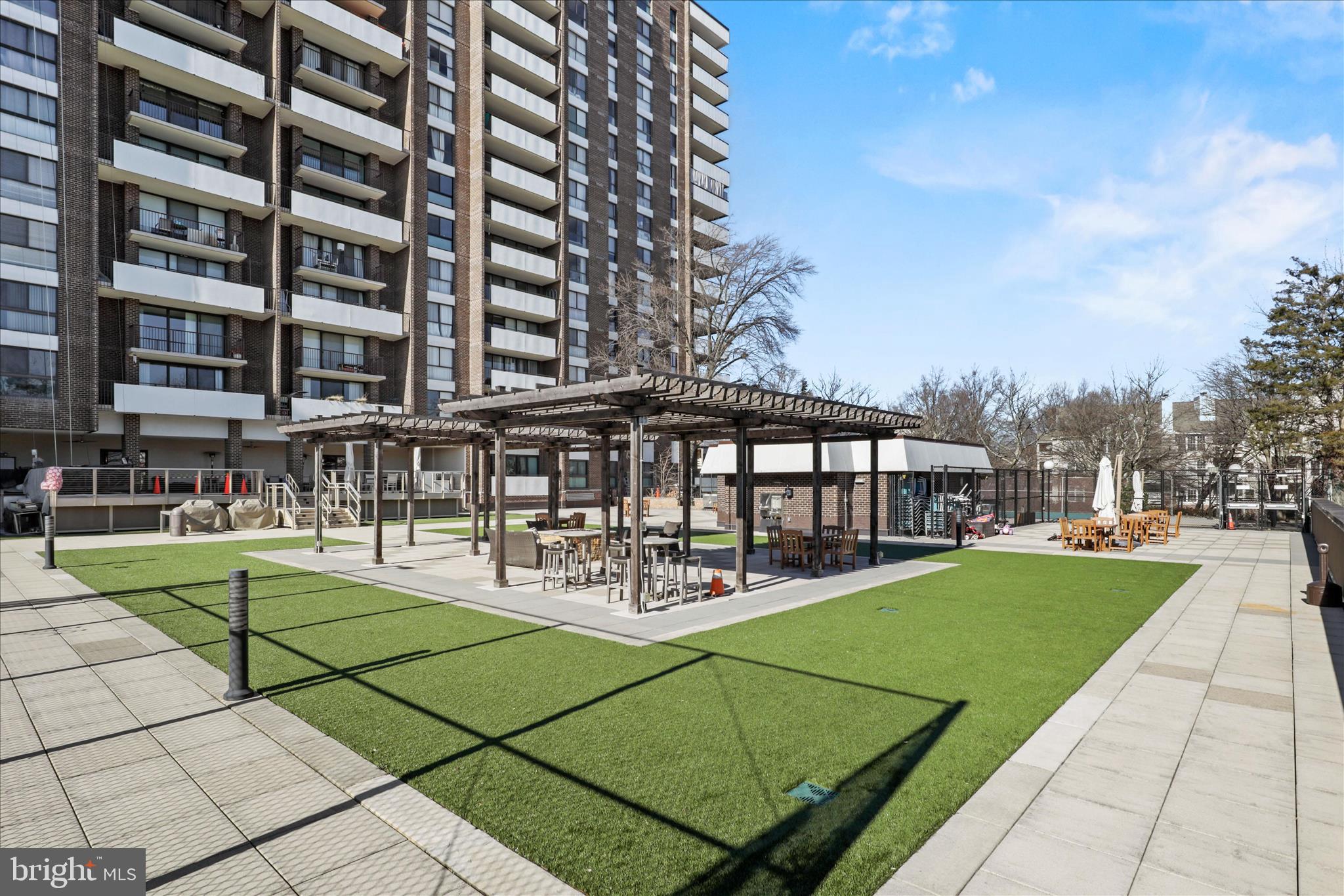 250 South Reynolds Street, Unit 105 Alexandria, VA 22304 - Photo 32 of 39 a view of a building with a yard