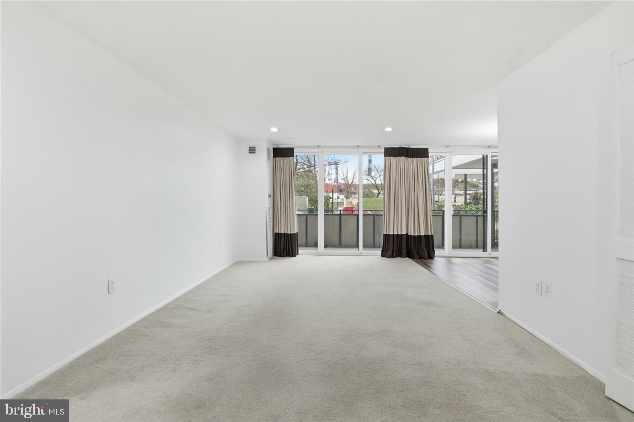 250 South Reynolds Street, Unit 105 Alexandria, VA 22304 - Photo 6 of 39 a view of a livingroom with a furniture