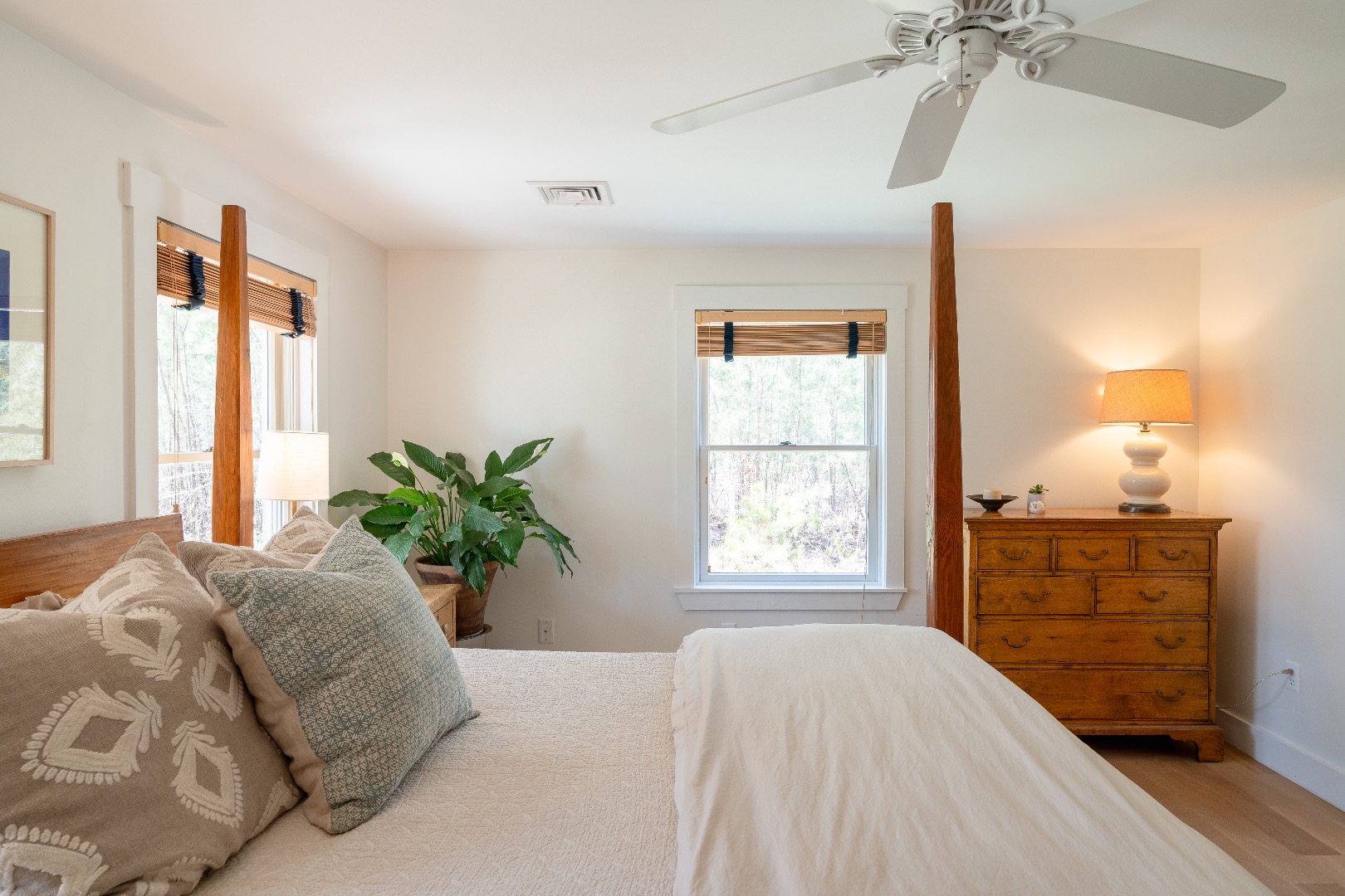 93 Hvoslef Way Vineyard Haven, MA 02568 - Photo 16 of 41 a bedroom with a bed and a chandelier