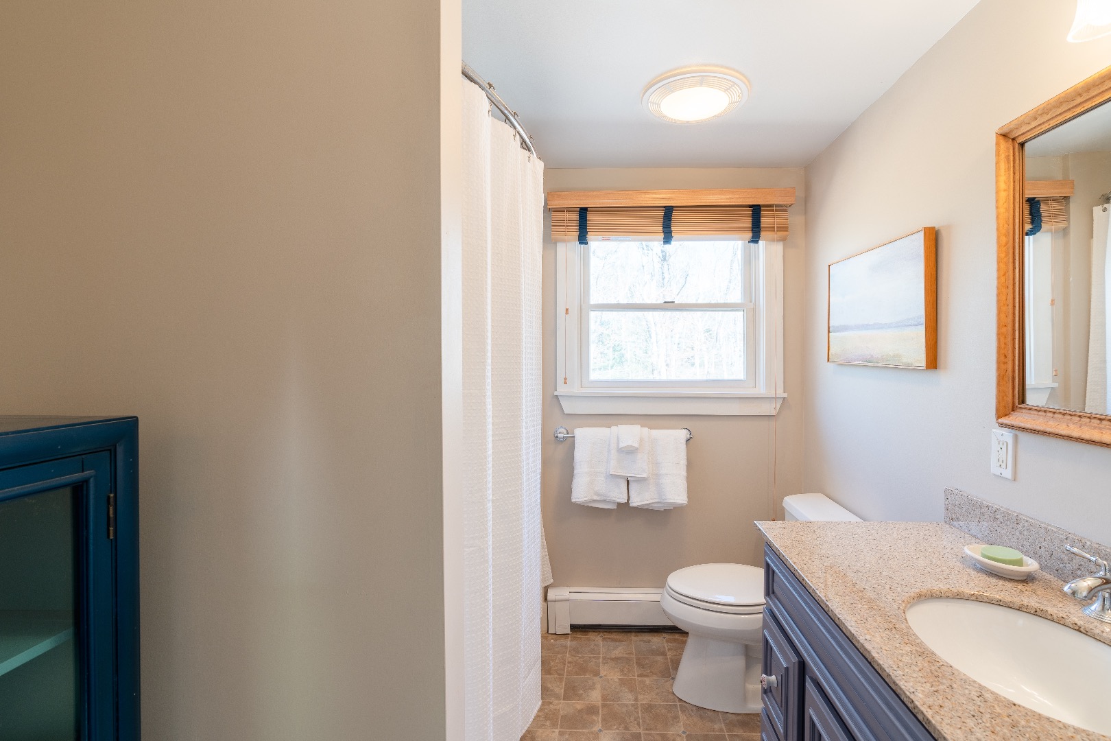 93 Hvoslef Way Vineyard Haven, MA 02568 - Photo 23 of 41 a bathroom with a granite countertop toilet a sink and a window