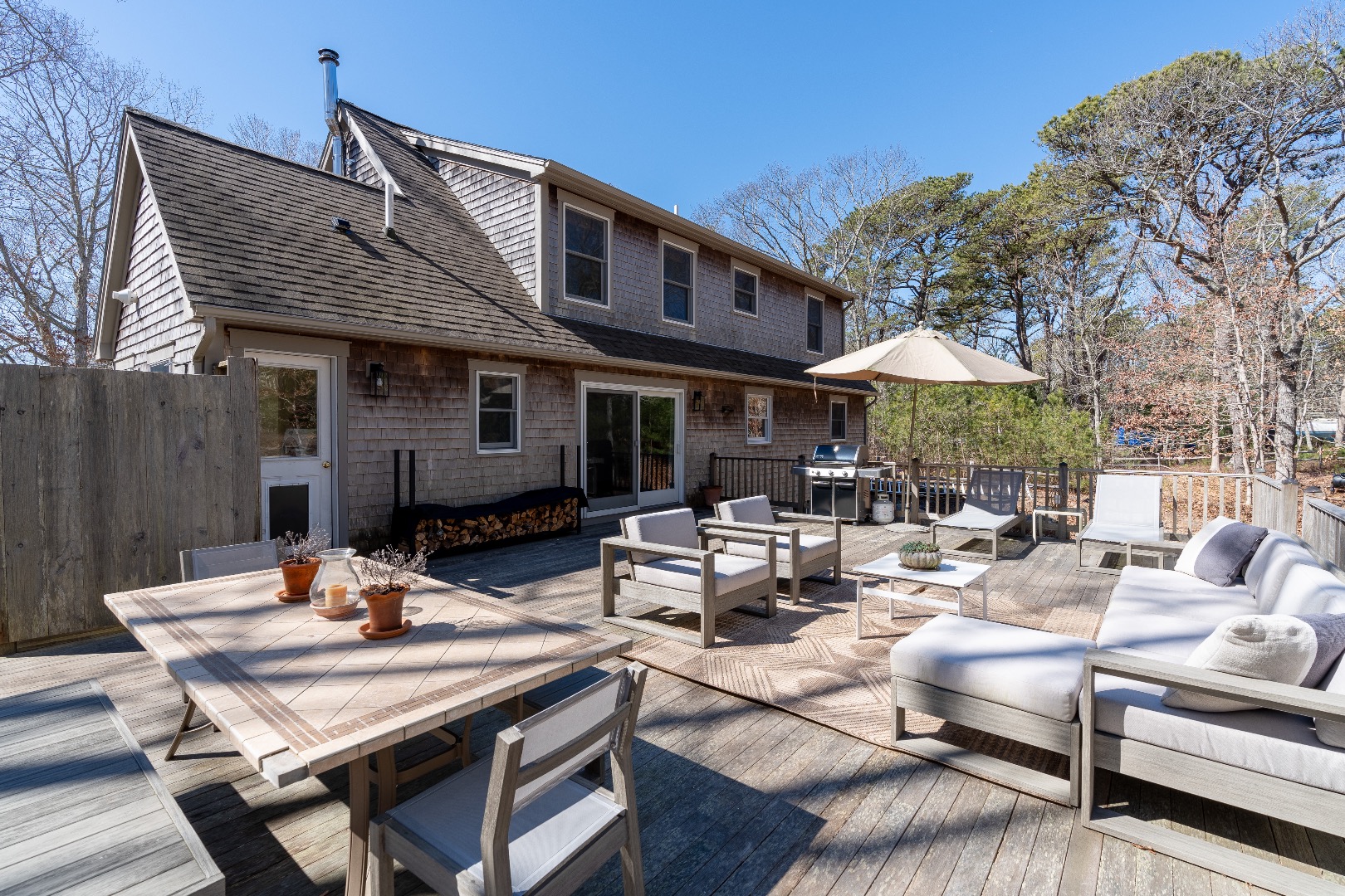 93 Hvoslef Way Vineyard Haven, MA 02568 - Photo 32 of 41 a view of a patio with furniture and a fire pit
