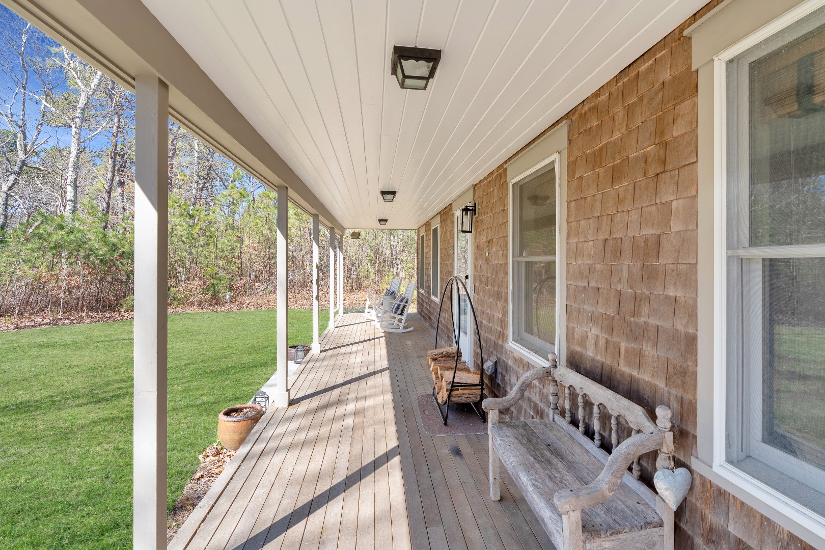 93 Hvoslef Way Vineyard Haven, MA 02568 - Photo 4 of 41 a view of a porch with chairs and backyard
