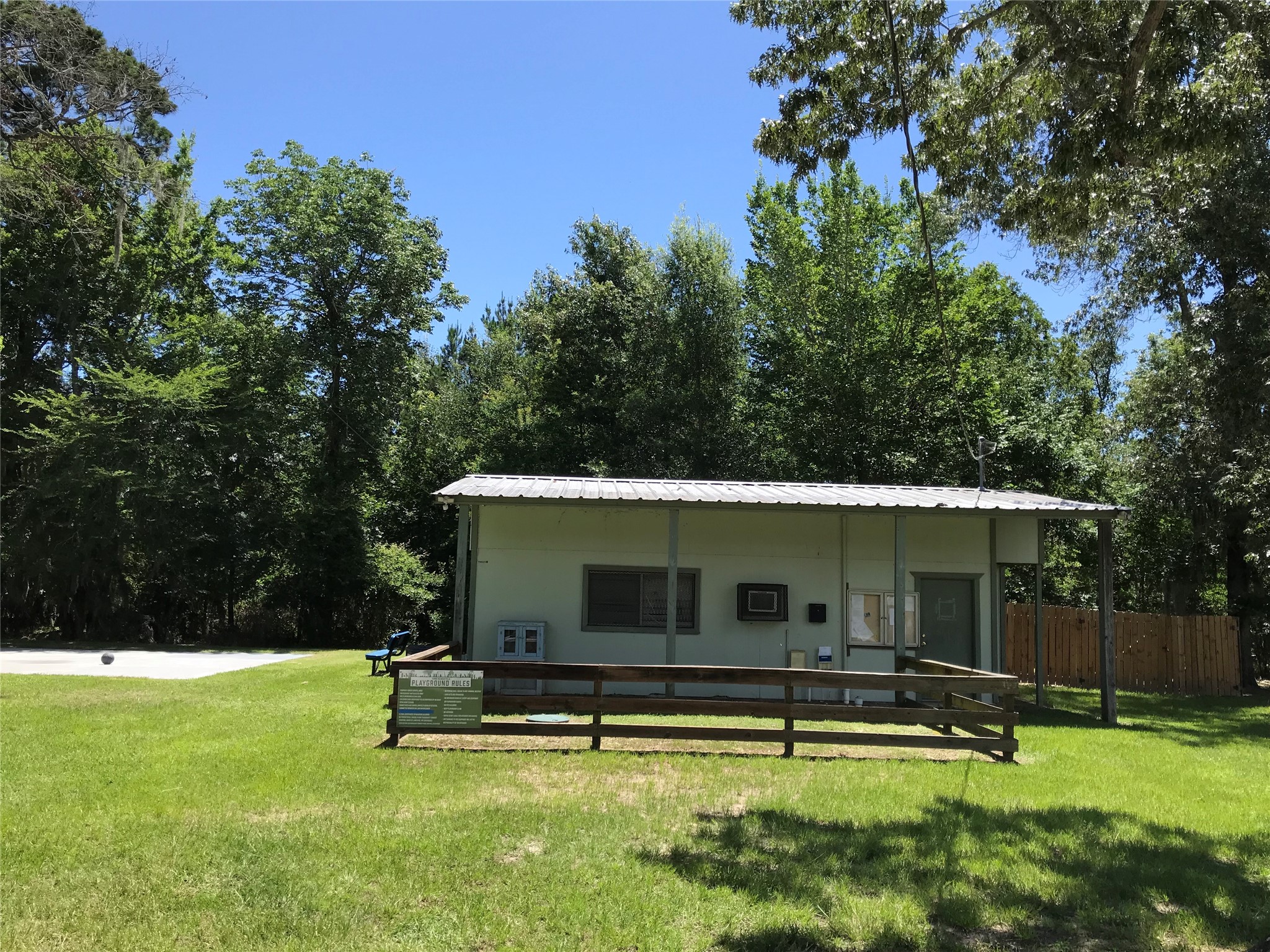 246 Brenda Road Trinity, TX 75862 - Photo 27 of 28 a backyard of a house with table and chairs