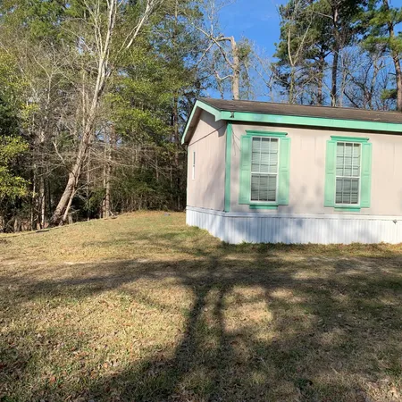 a view of swimming pool with a yard
