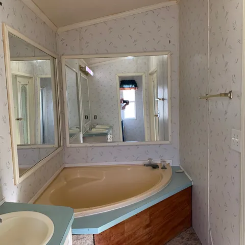 a bathroom with a shower and a door