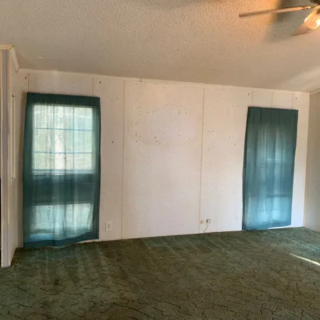 a view of an empty room and window
