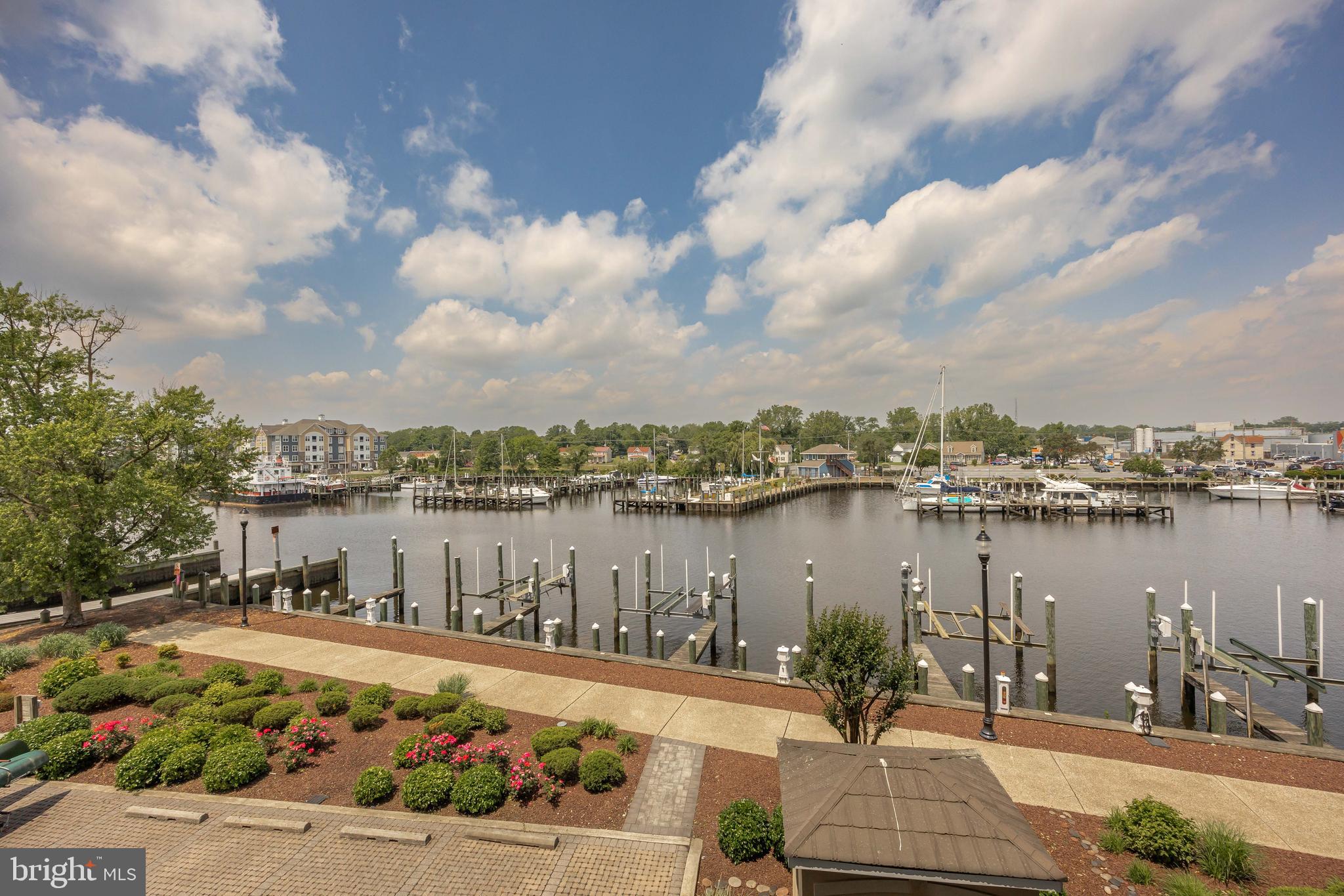 530 Riverside Drive, Unit 202 Salisbury, MD 21801 - Photo 2 of 61 a view of a lake with a patio