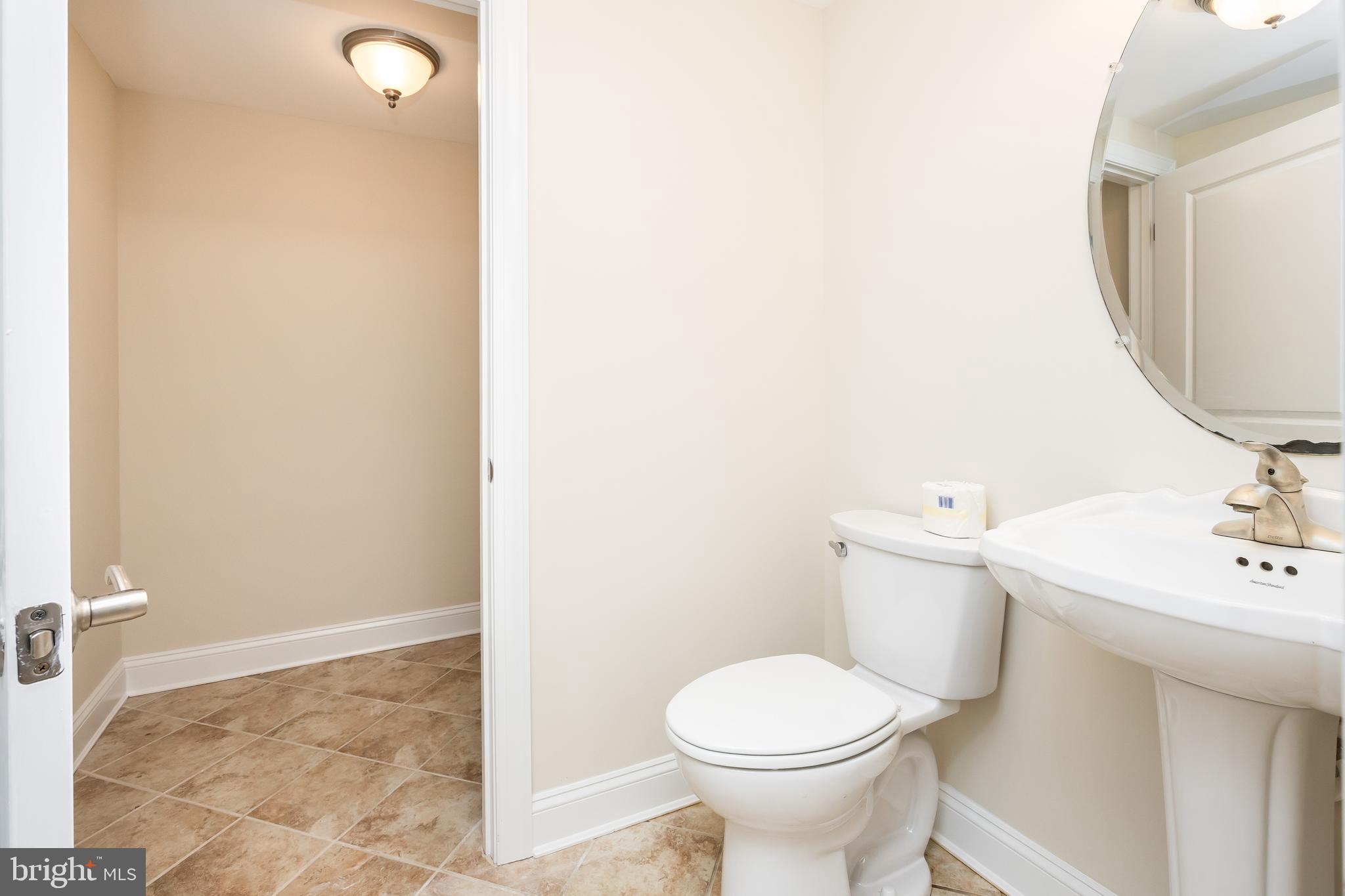 530 Riverside Drive, Unit 202 Salisbury, MD 21801 - Photo 25 of 61 a bathroom with a sink and a toilet