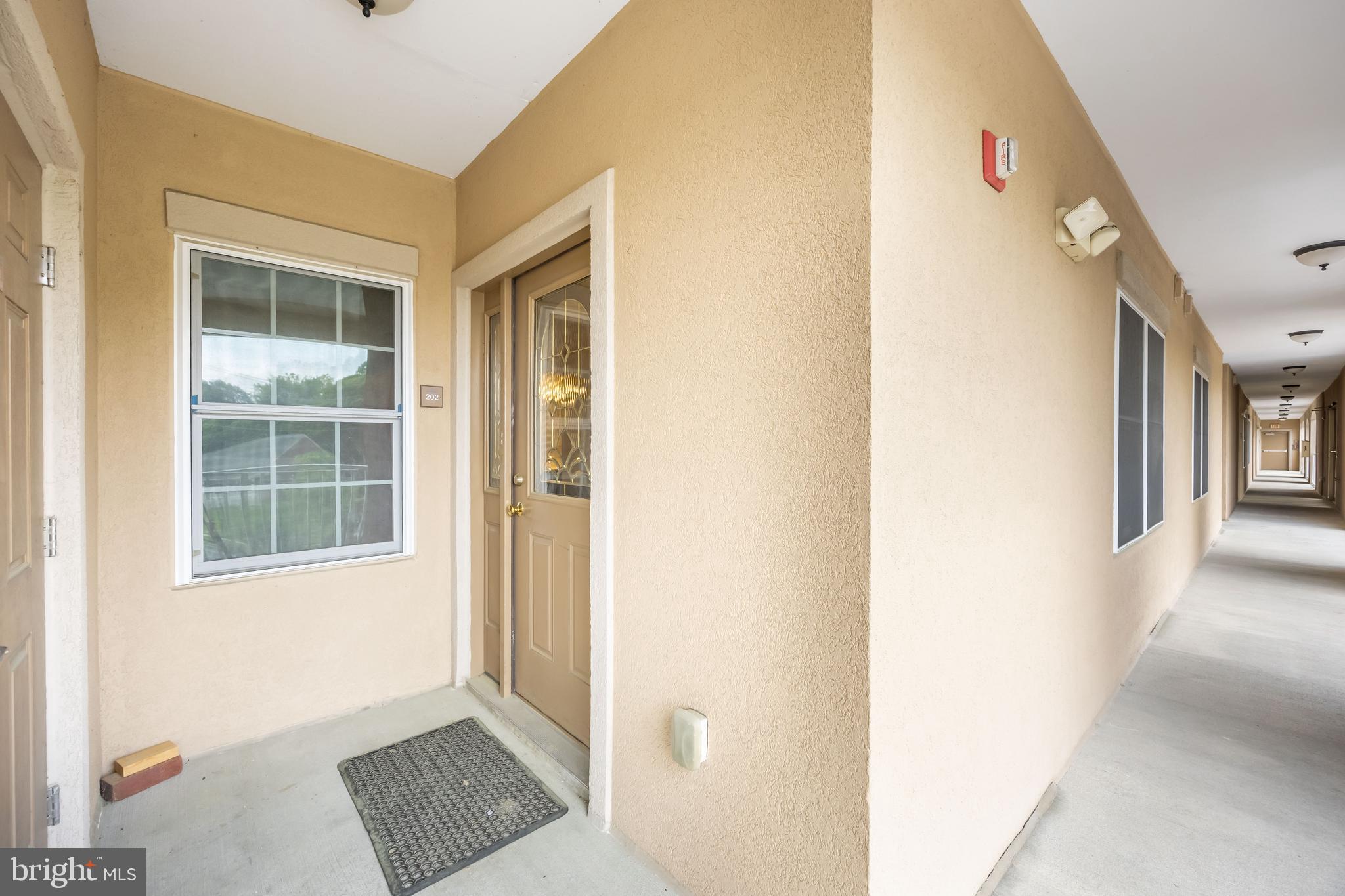 530 Riverside Drive, Unit 202 Salisbury, MD 21801 - Photo 46 of 61 a view of an empty room with windows
