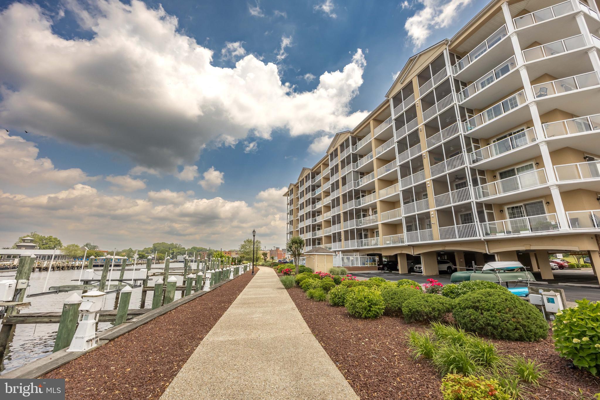 530 Riverside Drive, Unit 202 Salisbury, MD 21801 - Photo 52 of 61 a view of a building with a yard