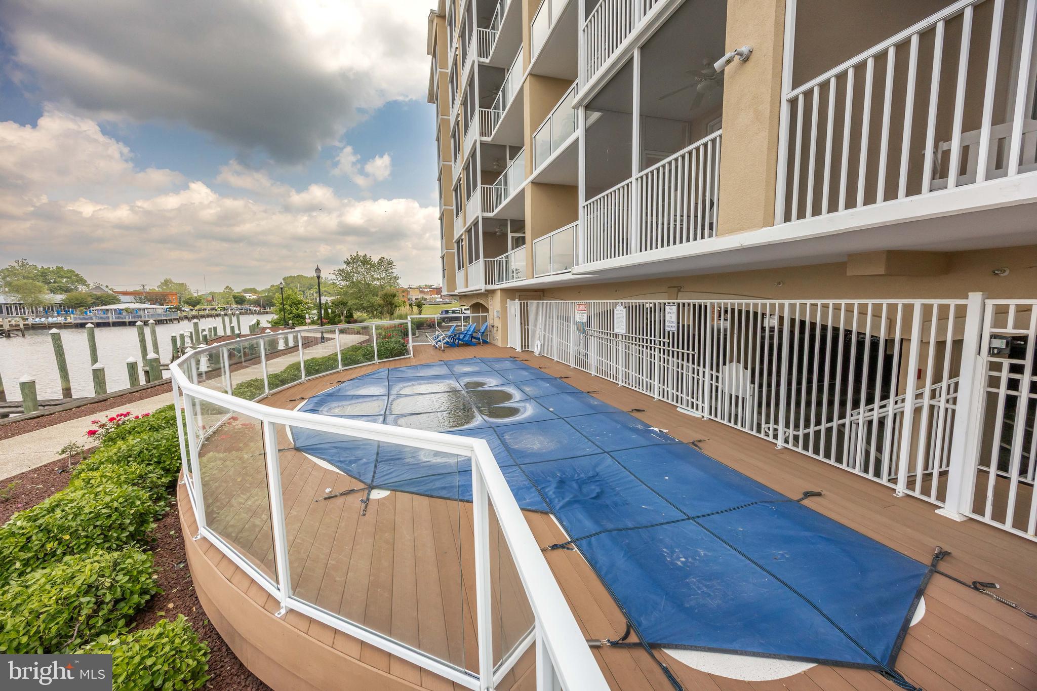 530 Riverside Drive, Unit 202 Salisbury, MD 21801 - Photo 55 of 61 a view of balcony with wooden floor and fence