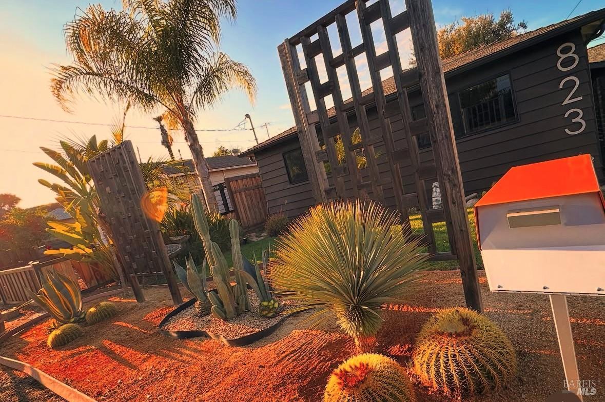 a view of backyard with swimming pool and outdoor seating