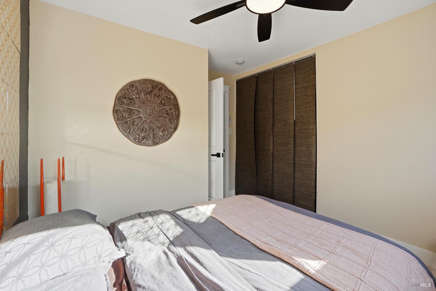 823 Shell Avenue Martinez, CA 94553 - Photo 15 of 39 a bedroom with a bed and a chandelier